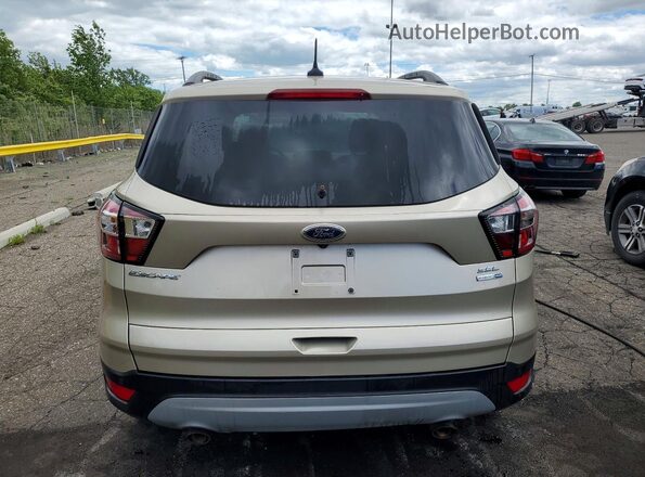 1FMCU9HD3JUA40947 2018 FORD ESCAPE Gold Widok wnętrza z przodu