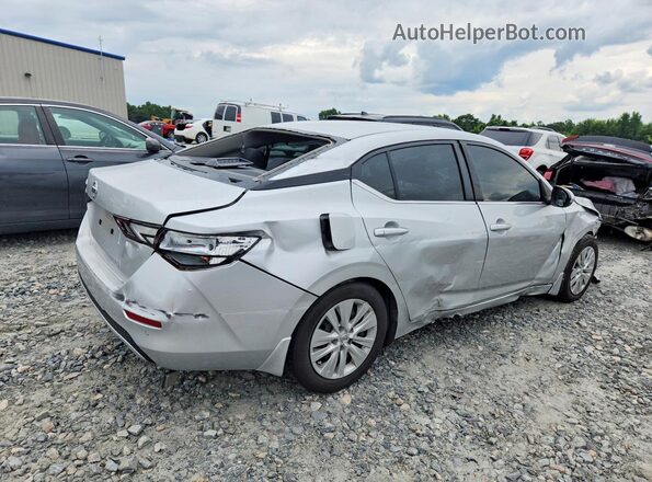 3N1AB8BV7PY323356 2023 NISSAN SENTRA Серебряный Передняя правая четверть