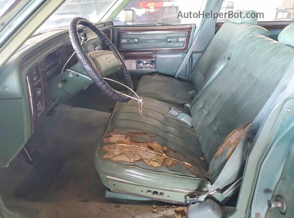 6D69S7Q312511 1977 CADILLAC DEVILLE Green Front interior view