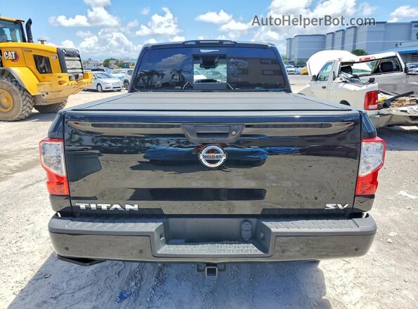 1N6AA1EFXMN526517 2021 NISSAN TITAN Black Widok wnętrza z przodu