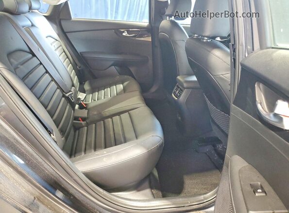 3KPF54AD8RE780113 2024 KIA FORTE Charcoal Vista interior trasera