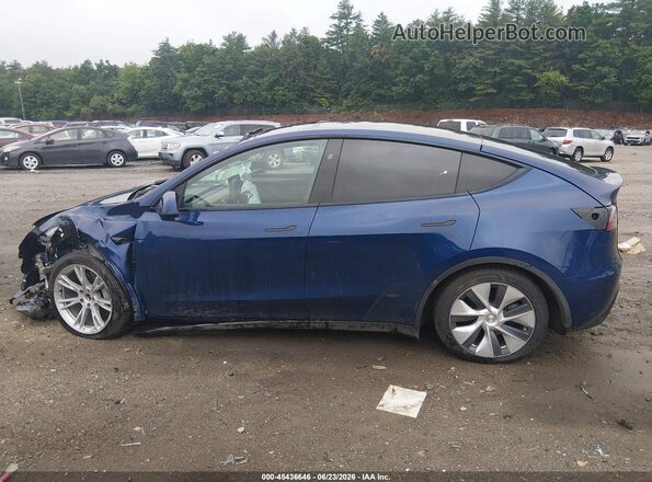 7SAYGAEE0RF989069 2024 TESLA MODEL Y Blue Սալոնի հետևի տեսք