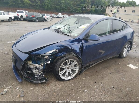 7SAYGAEE0RF989069 2024 TESLA MODEL Y Blue Առջևի ձախ երեք քառորդ տեսարան