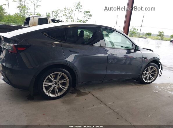 7SAYGAEE2PF613292 2023 TESLA MODEL Y Blue Սալոնի հետևի տեսք