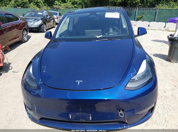 7SAYGAEE7RF063560 2024 TESLA MODEL Y Blue Սալոնի հետևի տեսք