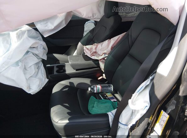 7SAYGAEE7RF092041 2024 TESLA MODEL Y Black Front interior view