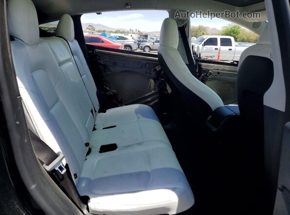 7SAYGAEE7SF239402 2025 TESLA MODEL Black Vista interior trasera