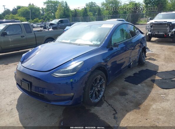 7SAYGAEEXRF206209 2024 TESLA MODEL Y Blue წინა მარცხენა ხედი სამი მეოთხედიდან