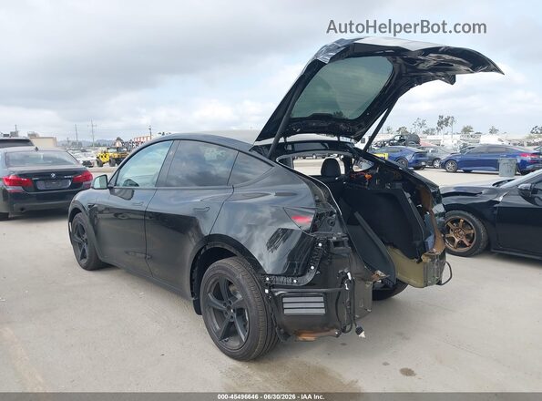 7SAYGDED0TF425406 2026 TESLA MODEL Y Black Rear left