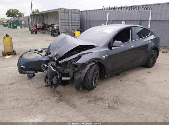 7SAYGDED1SF311476 2025 TESLA MODEL Y Black წინა მარცხენა ხედი სამი მეოთხედიდან