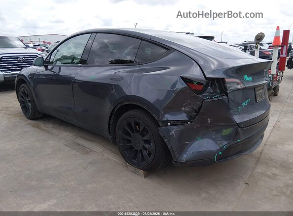 7SAYGDED2PF941823 2023 TESLA MODEL Y Gray Trasero izquierdo