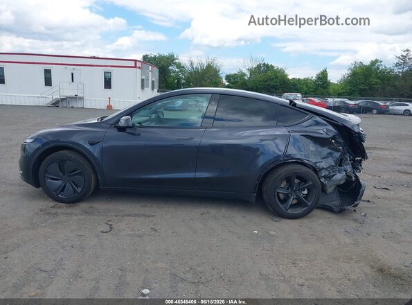 7SAYGDED2TF396037 2026 TESLA MODEL Y Gray Vista interior trasera