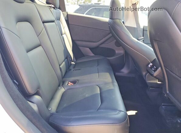 7SAYGDED3RF087153 2024 TESLA MODEL White Rear seats view