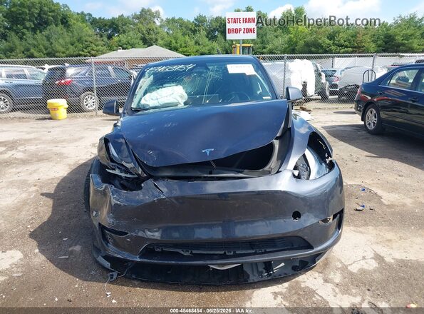 7SAYGDED4RF055747 2024 TESLA MODEL Y Gray Առջևի վահանակի տեսք