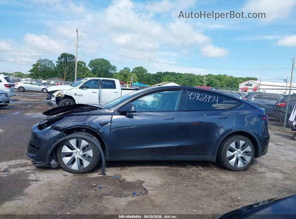 7SAYGDED4RF055747 2024 TESLA MODEL Y Gray Սալոնի հետևի տեսք