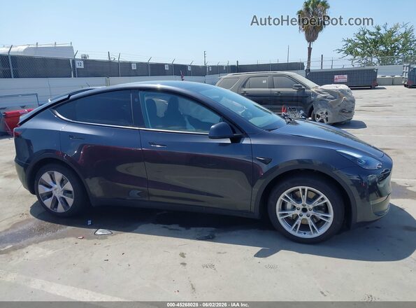 7SAYGDED5RF083878 2024 TESLA MODEL Y Black Սալոնի հետևի տեսք