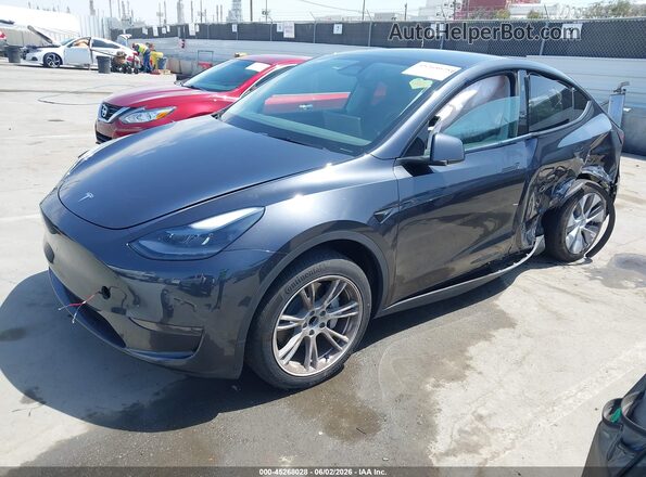 7SAYGDED5RF083878 2024 TESLA MODEL Y Black Առջևի ձախ երեք քառորդ տեսարան