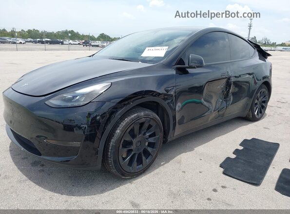 7SAYGDED7RF035203 2024 TESLA MODEL Y Black Vista tres cuartos delantera izquierda