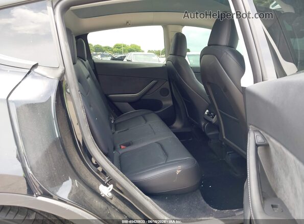 7SAYGDED7RF035203 2024 TESLA MODEL Y Black Vista de la etiqueta del VIN