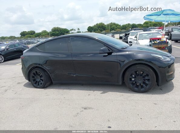 7SAYGDED7RF035203 2024 TESLA MODEL Y Black Vista del salpicadero
