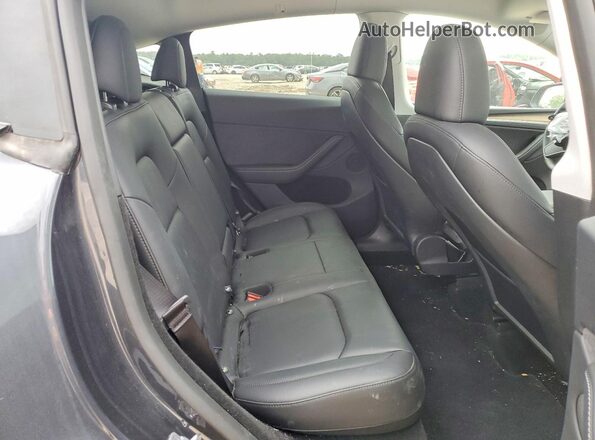 7SAYGDED7SA340056 2025 TESLA OTHER Charcoal Vista de los asientos traseros