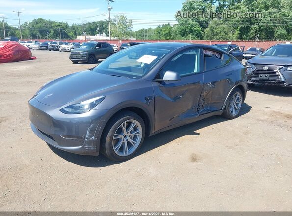 7SAYGDED9PF922802 2023 TESLA MODEL Y Gray Vista tres cuartos delantera izquierda