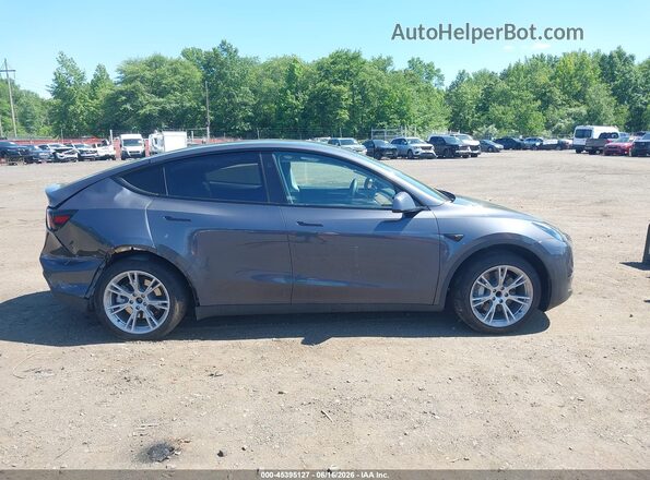 7SAYGDED9PF922802 2023 TESLA MODEL Y Gray Vista interior trasera