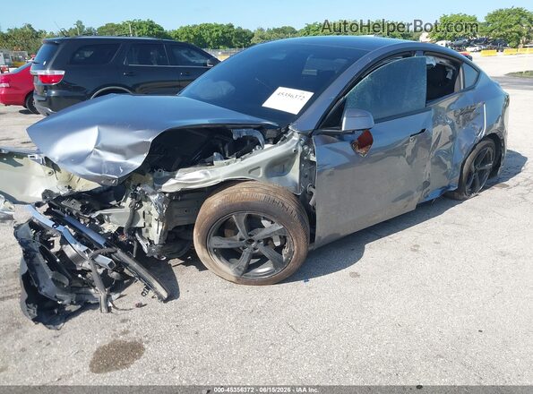 7SAYGDED9TA610082 2026 TESLA MODEL Y Gray Front left
