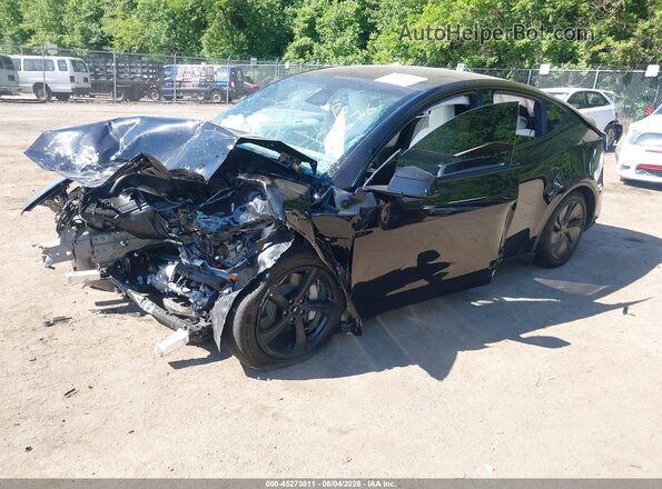 7SAYGDED9TF616676 2026 TESLA MODEL Y Black Առջևի ձախ երեք քառորդ տեսարան
