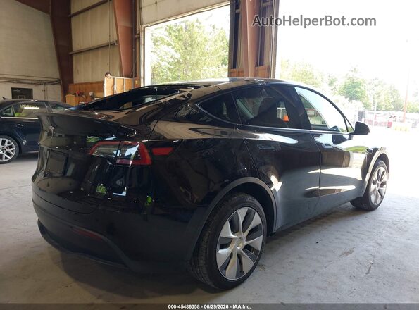 7SAYGDEDXPF940838 2023 TESLA MODEL Y Black Tył prawy