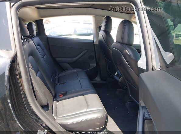 7SAYGDEE0NF411985 2022 TESLA MODEL Y Black Vista de la etiqueta del VIN