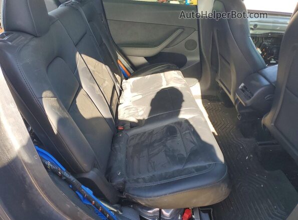 7SAYGDEE0PF860635 2023 TESLA MODEL Charcoal Vista de los asientos traseros