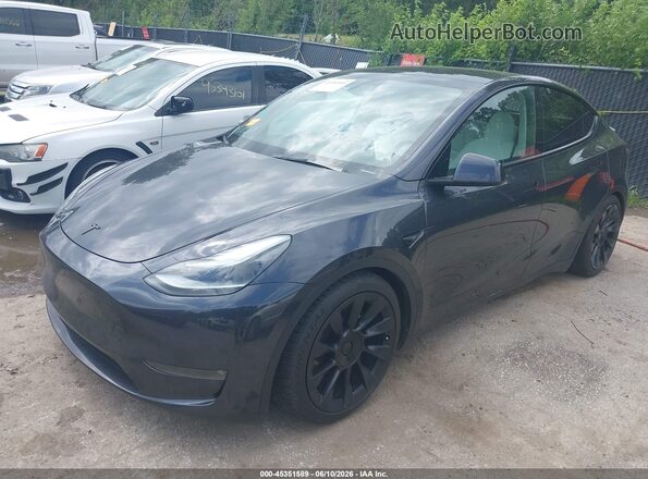 7SAYGDEE1RF204642 2024 TESLA MODEL Y Gray Vista tres cuartos delantera izquierda