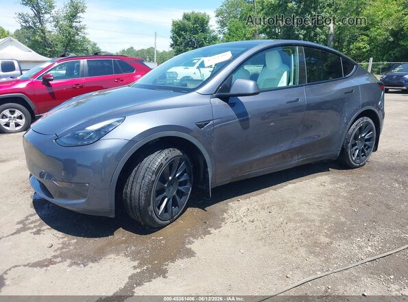 7SAYGDEE2PF692514 2023 TESLA MODEL Y Gray Vista tres cuartos delantera izquierda