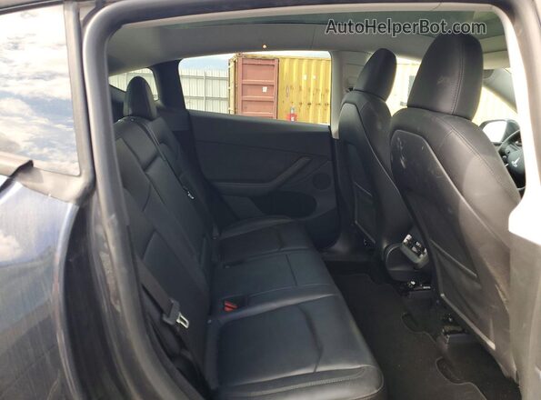 7SAYGDEE2RA245942 2024 TESLA MODEL Charcoal Вид задньої частини салону
