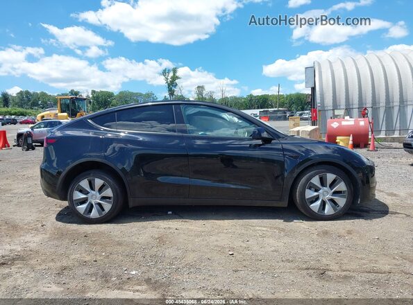 7SAYGDEE3PF597024 2023 TESLA MODEL Y Black Rear interior view
