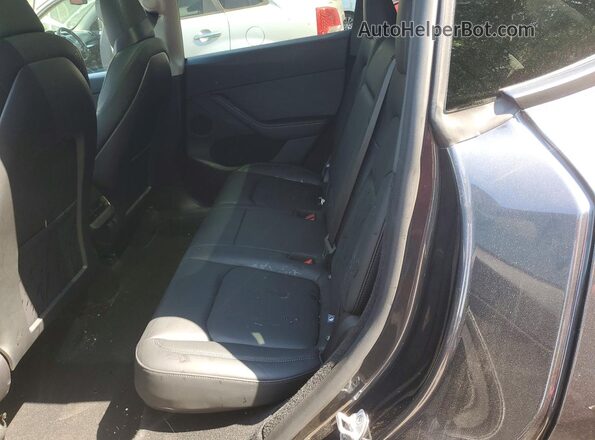 7SAYGDEE3SA356280 2025 TESLA MODEL Gray Սալոնի հետևի տեսք