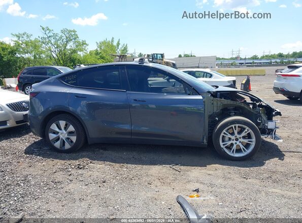 7SAYGDEE4PA106134 2023 TESLA MODEL Y Серый Вид задней части салона