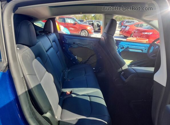7SAYGDEE4RA219259 2024 TESLA MODEL Blue Rear seats view