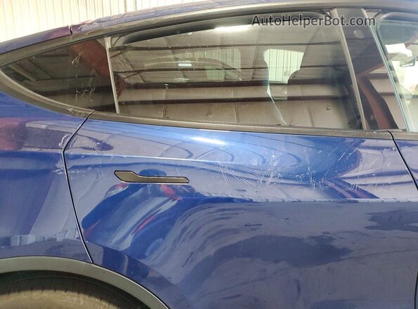 7SAYGDEE5NF441578 2022 TESLA MODEL Blue Vista de los asientos traseros