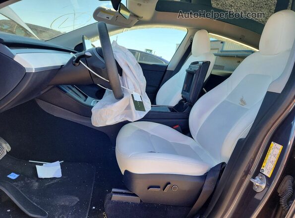 7SAYGDEE5PF879892 2023 TESLA MODEL Gray Front interior view