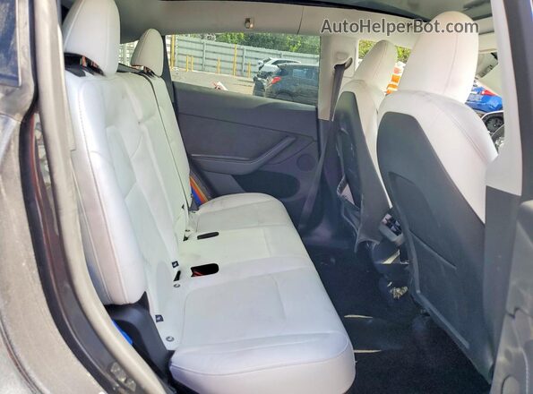 7SAYGDEE5SA360332 2025 TESLA MODEL Charcoal Rear interior view