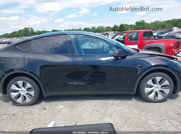 7SAYGDEE6PA171700 2023 TESLA MODEL Y Black Vista interior trasera