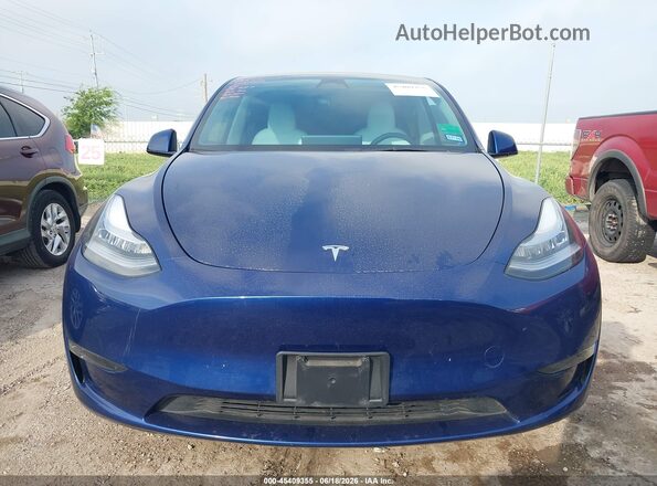 7SAYGDEE6PF604595 2023 TESLA MODEL Y Blue Widok wnętrza z tyłu