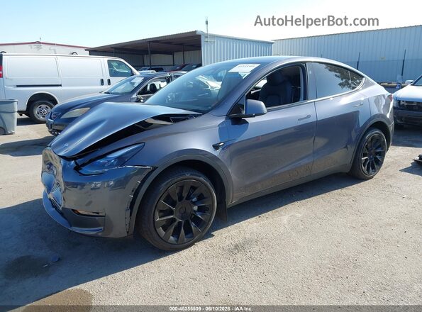 7SAYGDEE6PF797668 2023 TESLA MODEL Y Gray Առջևի ձախ երեք քառորդ տեսարան