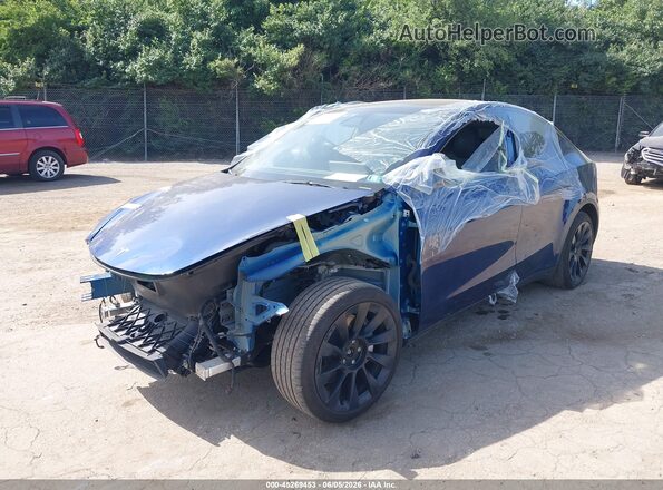 7SAYGDEE6RA227833 2024 TESLA MODEL Y Blue წინა მარცხენა ხედი სამი მეოთხედიდან