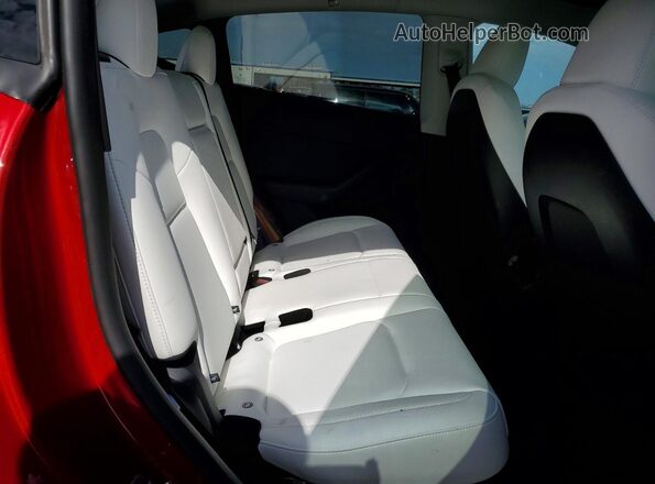 7SAYGDEE6SA352627 2025 TESLA MODEL Red Rear interior view