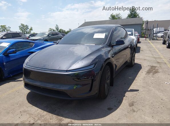 7SAYGDEE6TF588098 2026 TESLA MODEL Y Black წინა მარცხენა ხედი სამი მეოთხედიდან