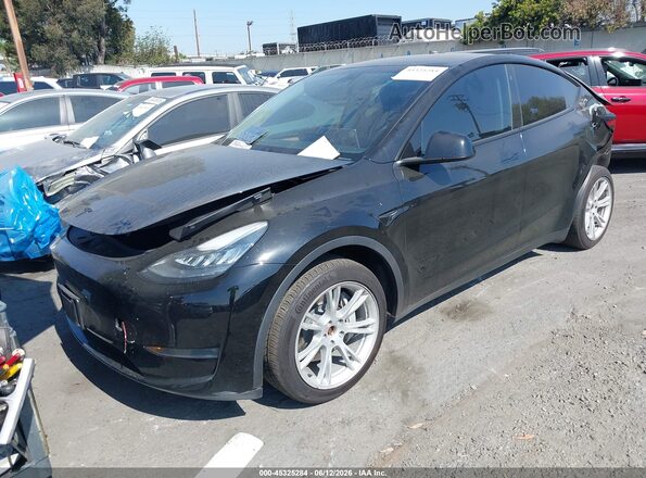 7SAYGDEE7PA125907 2023 TESLA MODEL Y Black Առջևի ձախ երեք քառորդ տեսարան
