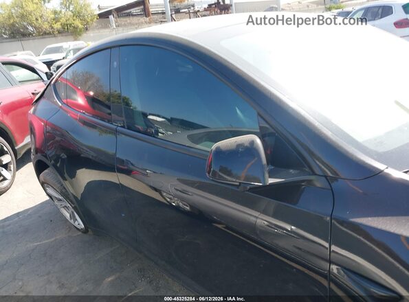 7SAYGDEE7PA125907 2023 TESLA MODEL Y Black Սալոնի հետևի տեսք